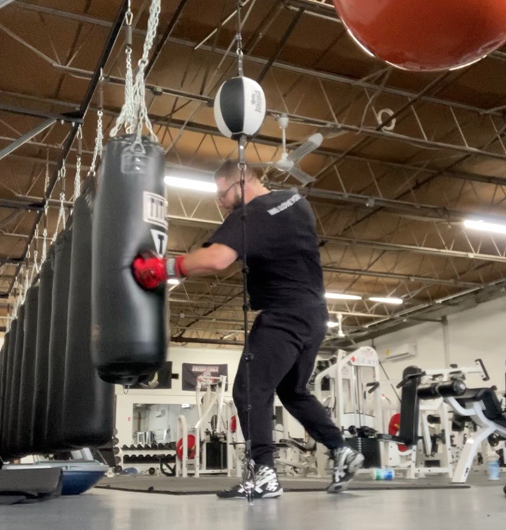Kyle Clancy punching boxing punching bag